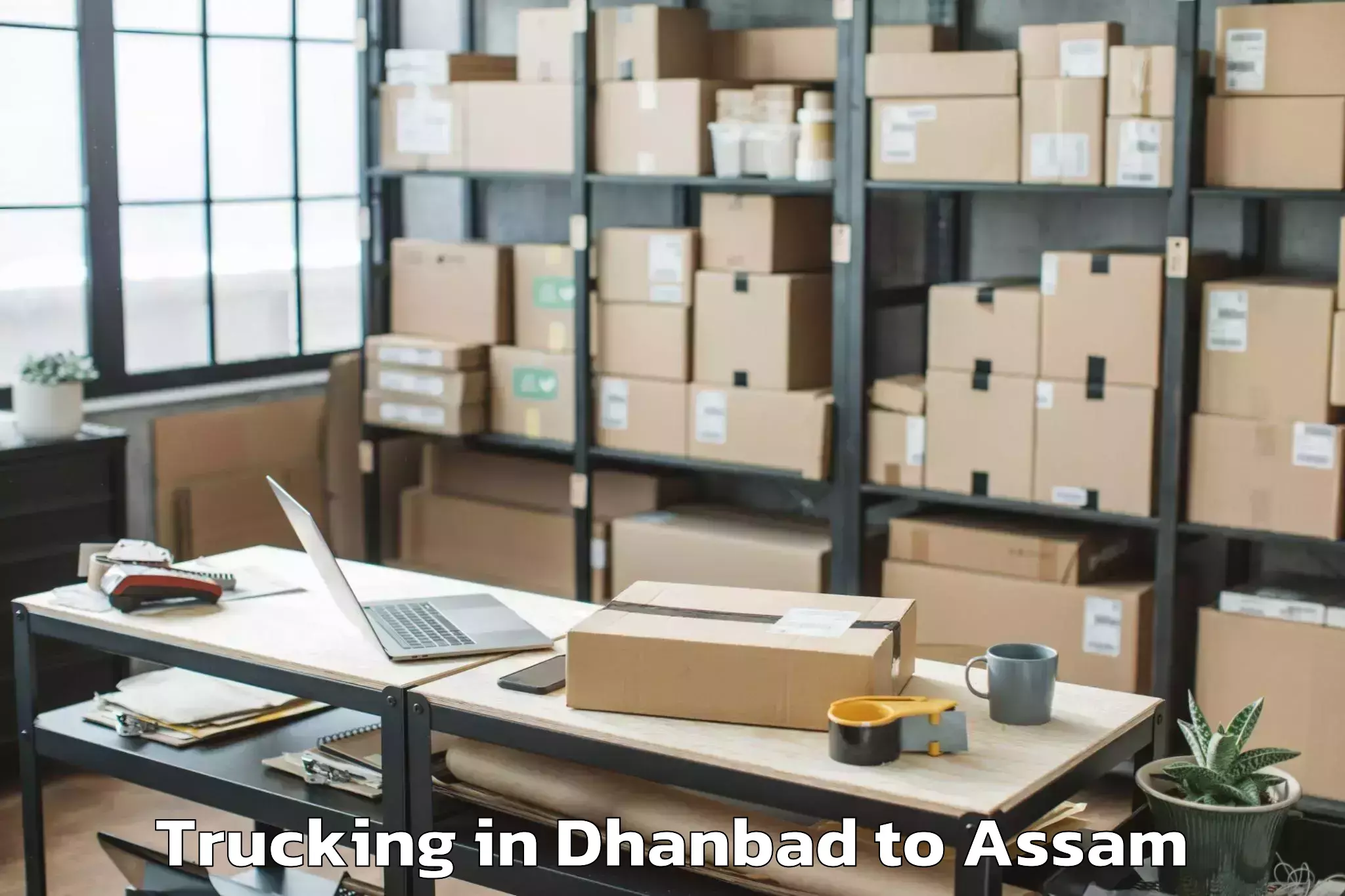 Professional Dhanbad to Samaguri Trucking